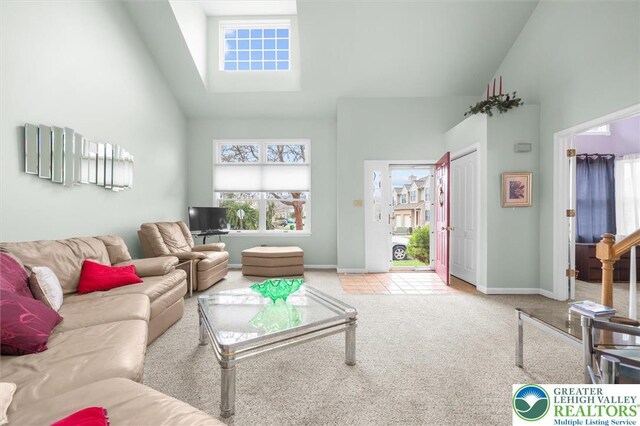 275 Ridings Cir, Macungie Boro, PA 18062 - living area featuring high vaulted ceiling, carpet flooring, and a skylight