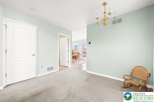 275 Ridings Cir, Macungie Borough, PA 18062 - unfurnished room featuring a chandelier, baseboards, and carpet floors