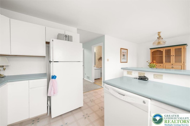 275 Ridings Cir, Macungie Borough, PA 18062 - kitchen featuring white appliances, light flooring, light countertops, and white cabinets
