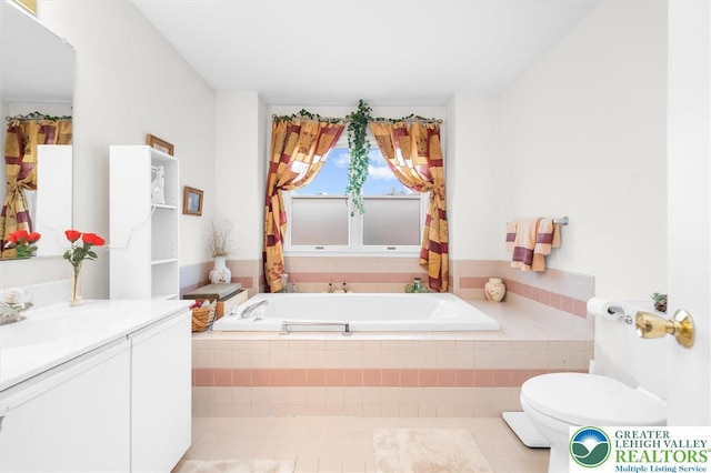 275 Ridings Cir, Macungie Borough, PA 18062 - full bathroom with toilet, vanity, a garden tub, and tile patterned flooring