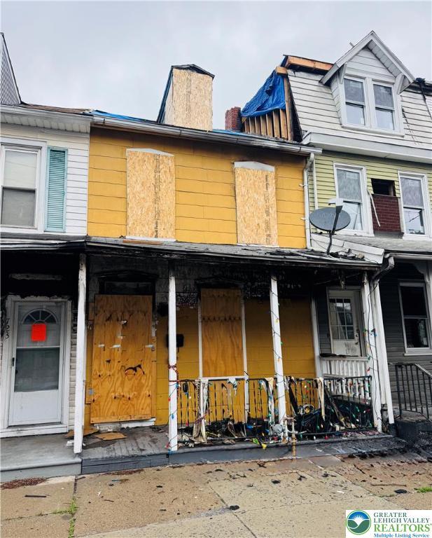 721 W Cedar St, Allentown City, PA 18102 - townhome / multi-family property featuring a porch and a chimney