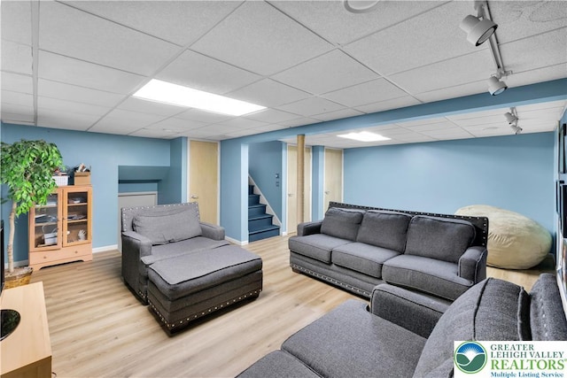 5401 Hale Ave, Hanover Twp, PA 18017 - living room featuring rail lighting, wood finished floors, stairway, and baseboards