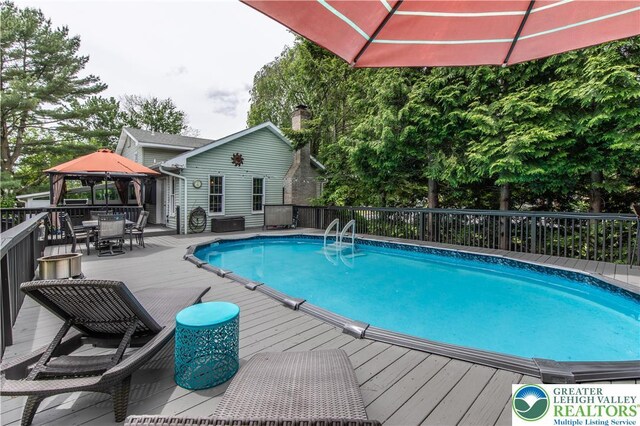 5401 Hale Ave, Hanover Twp, PA 18017 - view of pool with outdoor dining space, a gazebo, and a wooden deck