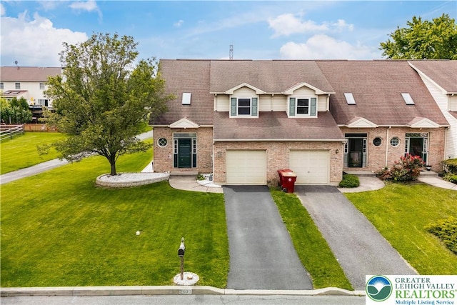 2630 Lower Way, Forks Twp, PA 18040 - view of front of house with driveway, a front yard, a garage, and brick siding