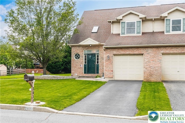 2630 Lower Way, Forks Twp, PA 18040 - view of front facade with driveway, a garage, brick siding, and roof with shingles