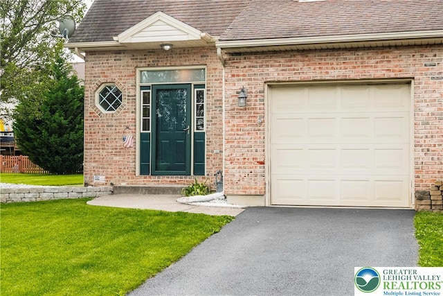 2630 Lower Way, Forks Twp, PA 18040 - entrance to property featuring a shingled roof, brick siding, driveway, and an attached garage
