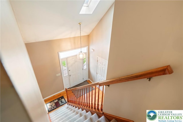 2630 Lower Way, Forks Twp, PA 18040 - foyer entrance featuring a skylight, stairs, vaulted ceiling, baseboards, and wood finished floors