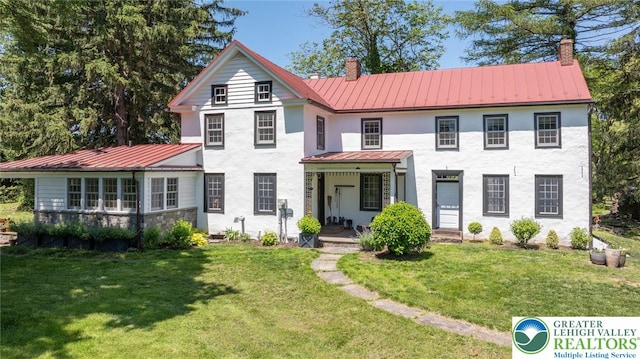 408 Kintner Hill Rd, Nockamixon Twp, PA 18972 - view of front of property featuring a standing seam roof, a chimney, metal roof, a front yard, and a porch