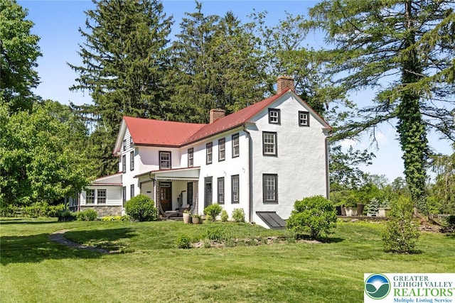 408 Kintner Hill Rd, Nockamixon Twp, PA 18972 - view of front of property with a chimney, a front lawn, metal roof, and stucco siding