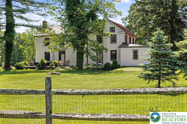 408 Kintner Hill Rd, Nockamixon Twp, PA 18972 - view of front of property featuring a standing seam roof, stucco siding, metal roof, a chimney, and a front lawn