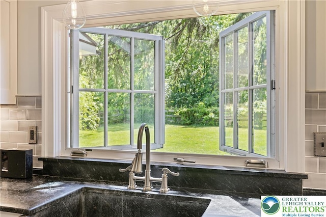 408 Kintner Hill Rd, Nockamixon Twp, PA 18972 - kitchen featuring a sink, backsplash, and dark stone counters