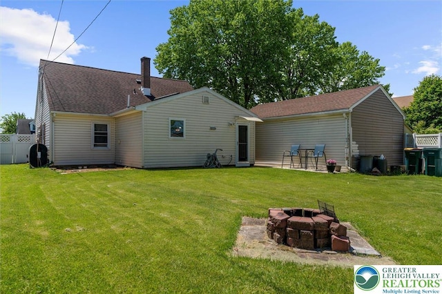 3079 Eldridge Ave, Palmer Twp, PA 18045 - back of property featuring an outdoor fire pit, a chimney, and a shingled roof