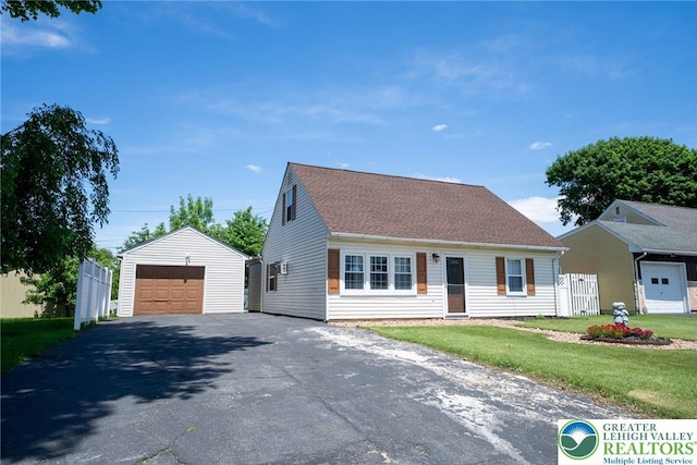 3079 Eldridge Ave, Palmer Twp, PA 18045 - cape cod-style house featuring a detached garage, an outdoor structure, and asphalt driveway