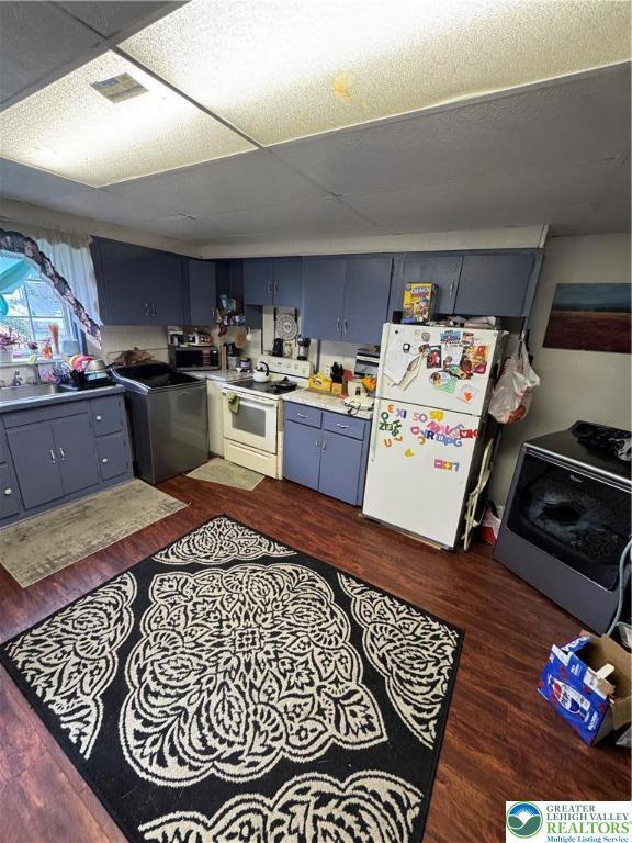 109 S Chestnut St, Summit Hill Borough, PA 18250 - kitchen with white appliances, washer / clothes dryer, dark wood-style flooring, and a sink
