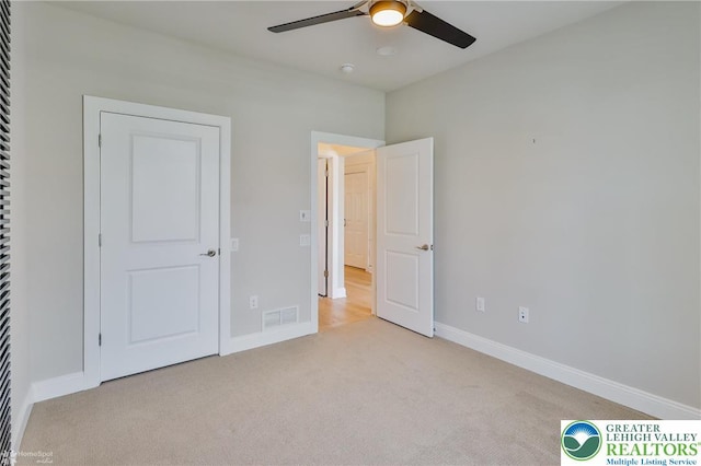 3896 Independence Dr, Easton, PA 18045 - unfurnished bedroom with light carpet, baseboards, and ceiling fan