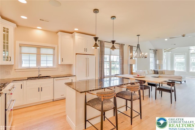 3896 Independence Dr, Easton, PA 18045 - kitchen featuring a sink, double oven range, dark stone countertops, healthy amount of natural light, and recessed lighting