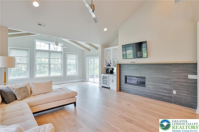 3896 Independence Dr, Easton, PA 18045 - living area featuring beverage cooler, light wood finished floors, recessed lighting, baseboards, and bar