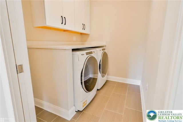 3896 Independence Dr, Easton, PA 18045 - washroom featuring washing machine and clothes dryer, cabinet space, baseboards, and light tile patterned floors