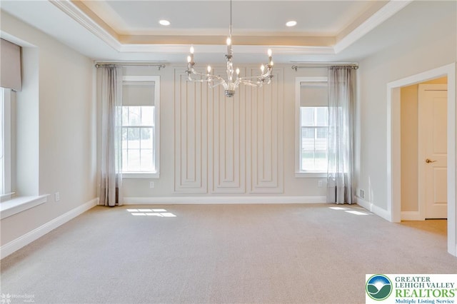3896 Independence Dr, Easton, PA 18045 - carpeted empty room featuring a raised ceiling, a chandelier, healthy amount of natural light, crown molding, and baseboards