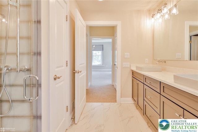 3896 Independence Dr, Easton, PA 18045 - bathroom featuring double vanity, marble look tiles, baseboards, and a shower with door