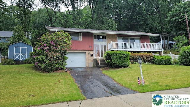 1426 Church St, Fountain Hill Boro, PA 18015 - raised ranch featuring brick siding, driveway, a garage, and a front lawn