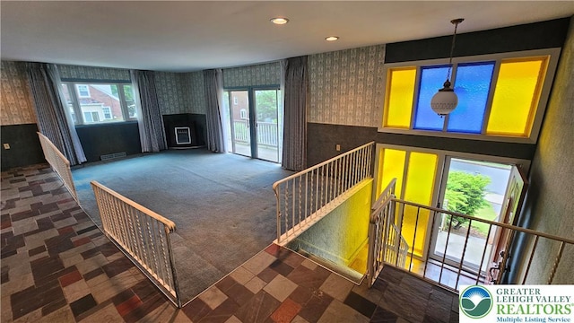 1426 Church St, Fountain Hill Boro, PA 18015 - unfurnished living room with wallpapered walls, a fireplace, plenty of natural light, and recessed lighting