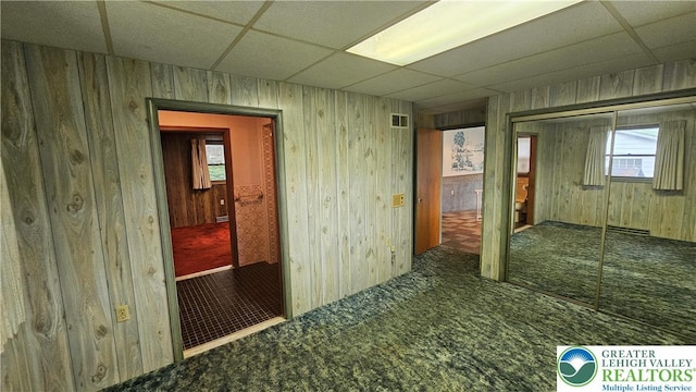 1426 Church St, Fountain Hill Boro, PA 18015 - empty room with a drop ceiling, carpet floors, healthy amount of natural light, and wood walls