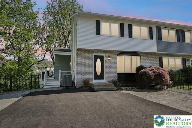 624 E 8th St, Northampton Borough, PA 18067 - townhome / multi-family property featuring brick siding, central AC unit, and entry steps