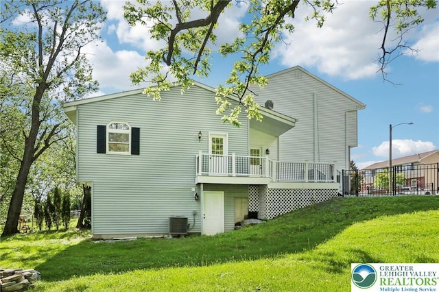 624 E 8th St, Northampton Borough, PA 18067 - rear view of property with a deck, a yard, and central AC unit