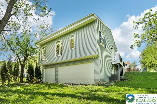 624 E 8th St, Northampton Borough, PA 18067 - view of side of property featuring an attached garage and central AC