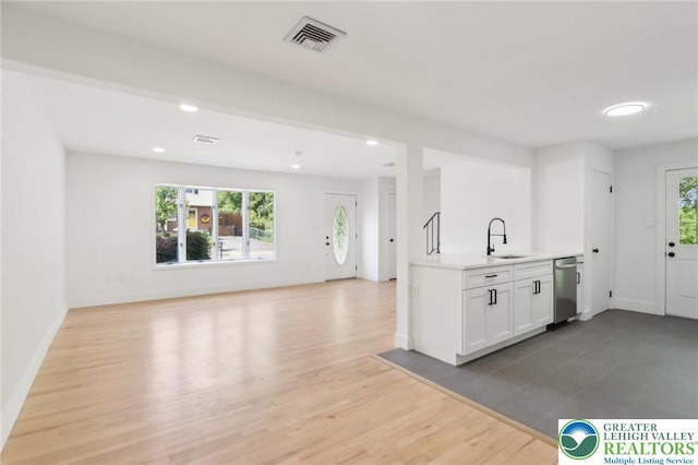 624 E 8th St, Northampton Borough, PA 18067 - kitchen with a sink, dishwasher, light countertops, recessed lighting, and open floor plan