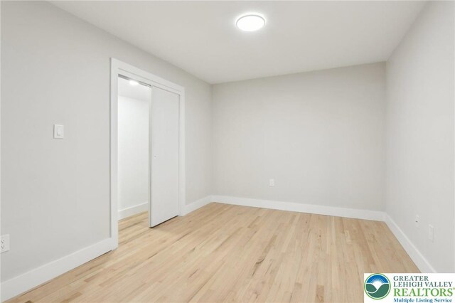 624 E 8th St, Northampton Borough, PA 18067 - unfurnished bedroom with wood finished floors, baseboards, and a closet