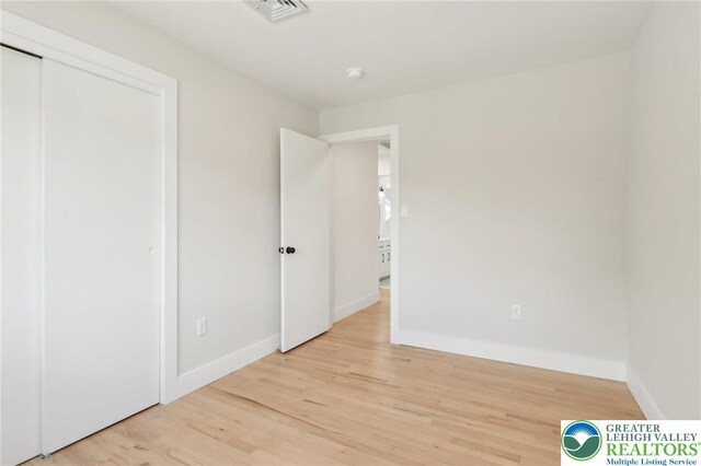 624 E 8th St, Northampton Borough, PA 18067 - unfurnished bedroom with light wood-type flooring, baseboards, and a closet