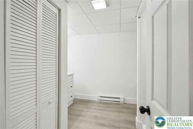 624 E 8th St, Northampton Borough, PA 18067 - spacious closet featuring a baseboard heating unit, light wood finished floors, and a paneled ceiling
