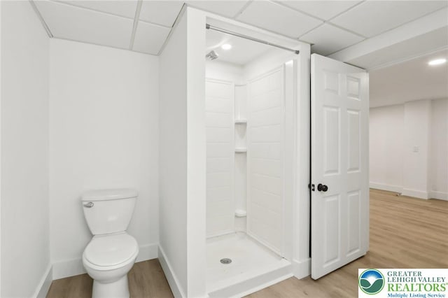 624 E 8th St, Northampton Borough, PA 18067 - full bathroom featuring a shower stall, wood finished floors, a paneled ceiling, toilet, and baseboards