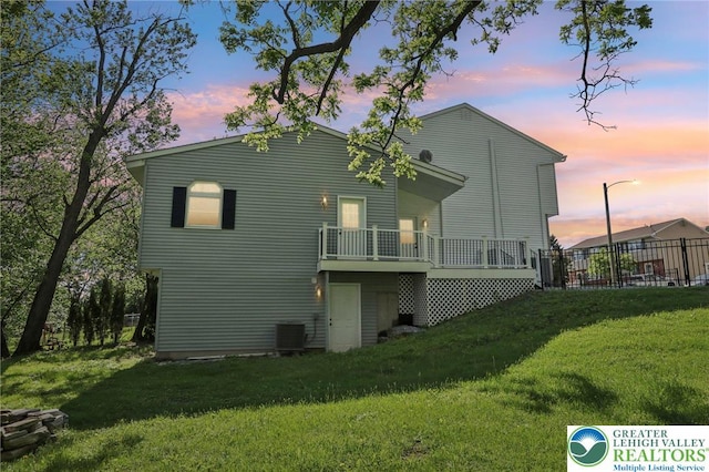 624 E 8th St, Northampton Borough, PA 18067 - back of house at dusk with a deck and central AC