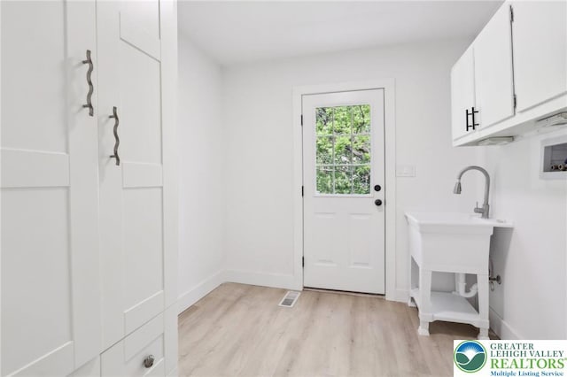 624 E 8th St, Northampton Borough, PA 18067 - washroom featuring cabinet space, light wood finished floors, washer hookup, and baseboards