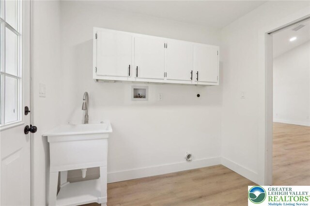 624 E 8th St, Northampton Borough, PA 18067 - laundry room with cabinet space, hookup for a washing machine, baseboards, and light wood finished floors