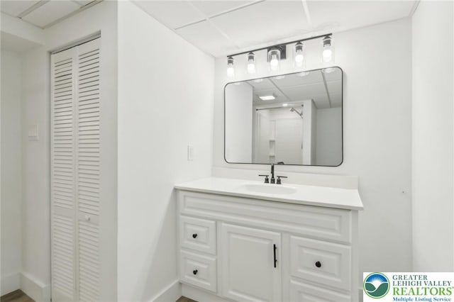 624 E 8th St, Northampton Borough, PA 18067 - bathroom with a closet, a paneled ceiling, and vanity