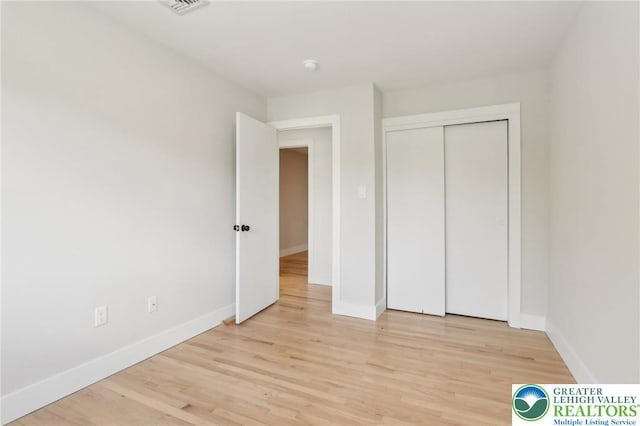 624 E 8th St, Northampton Borough, PA 18067 - unfurnished bedroom with baseboards, light wood-type flooring, and a closet