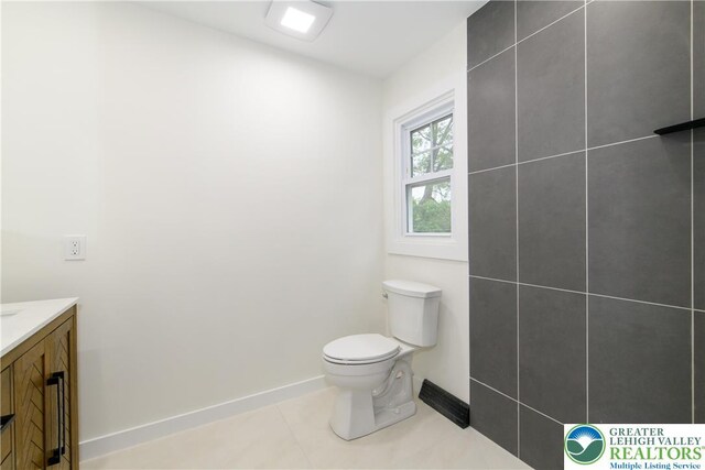1360 Cherry Ave, Hanover Twp, PA 18017 - bathroom with toilet, vanity, and baseboards