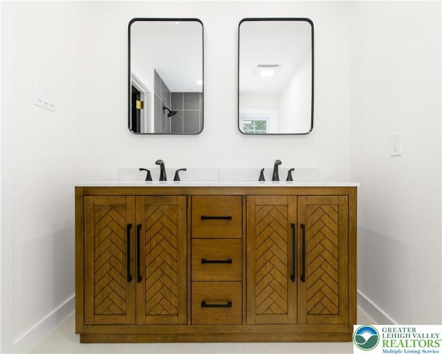 1360 Cherry Ave, Hanover Twp, PA 18017 - bathroom featuring baseboards and double vanity