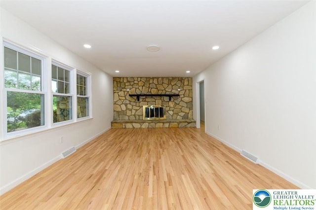 1360 Cherry Ave, Hanover Twp, PA 18017 - unfurnished living room with wood finished floors, baseboards, a stone fireplace, and recessed lighting