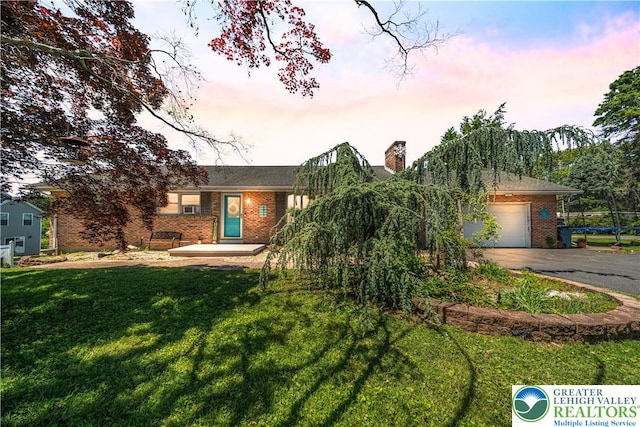 2617 5th St, Bethlehem City, PA 18020 - ranch-style house featuring brick siding, driveway, and a lawn