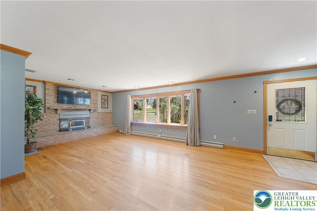 2617 5th St, Bethlehem City, PA 18020 - unfurnished living room with ornamental molding, wood finished floors, a brick fireplace, baseboards, and recessed lighting