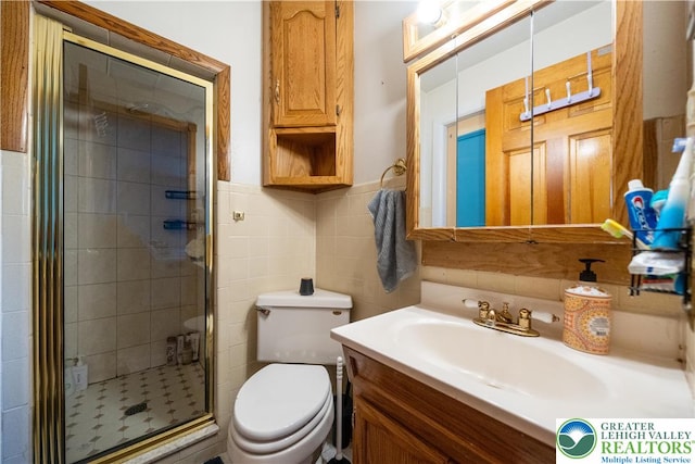 2617 5th St, Bethlehem City, PA 18020 - full bathroom with vanity, a stall shower, toilet, and tile walls