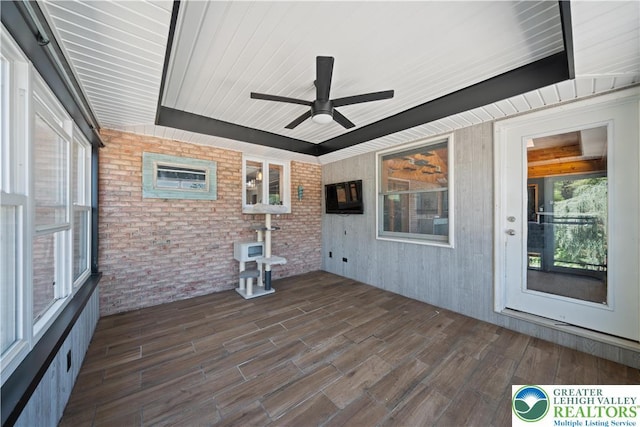 2617 5th St, Bethlehem City, PA 18020 - unfurnished sunroom featuring wood finished floors and brick wall