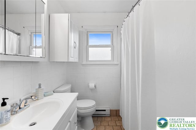 956 E Linden St, Allentown City, PA 18109 - full bath with a baseboard heating unit, tile walls, toilet, vanity, and decorative backsplash