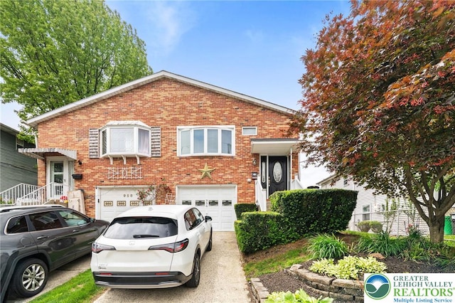 956 E Linden St, Allentown City, PA 18109 - split level home with brick siding, an attached garage, and concrete driveway