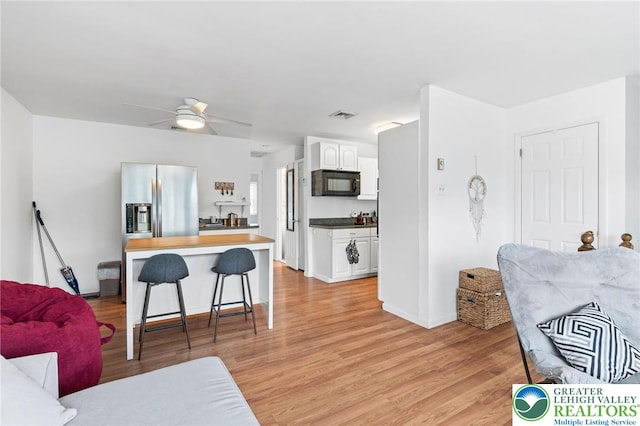 956 E Linden St, Allentown City, PA 18109 - living area featuring ceiling fan, light wood finished floors, and baseboards